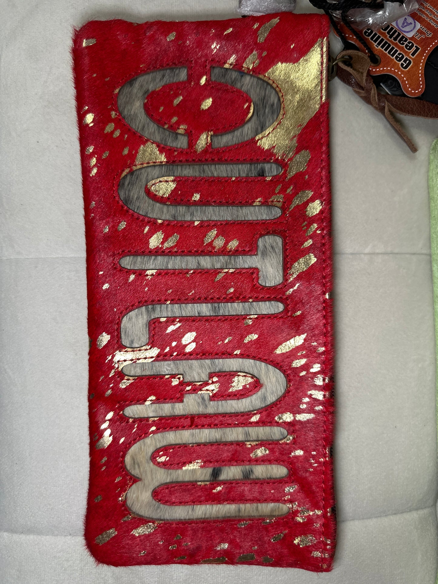 American Darling cowhide clutch w words