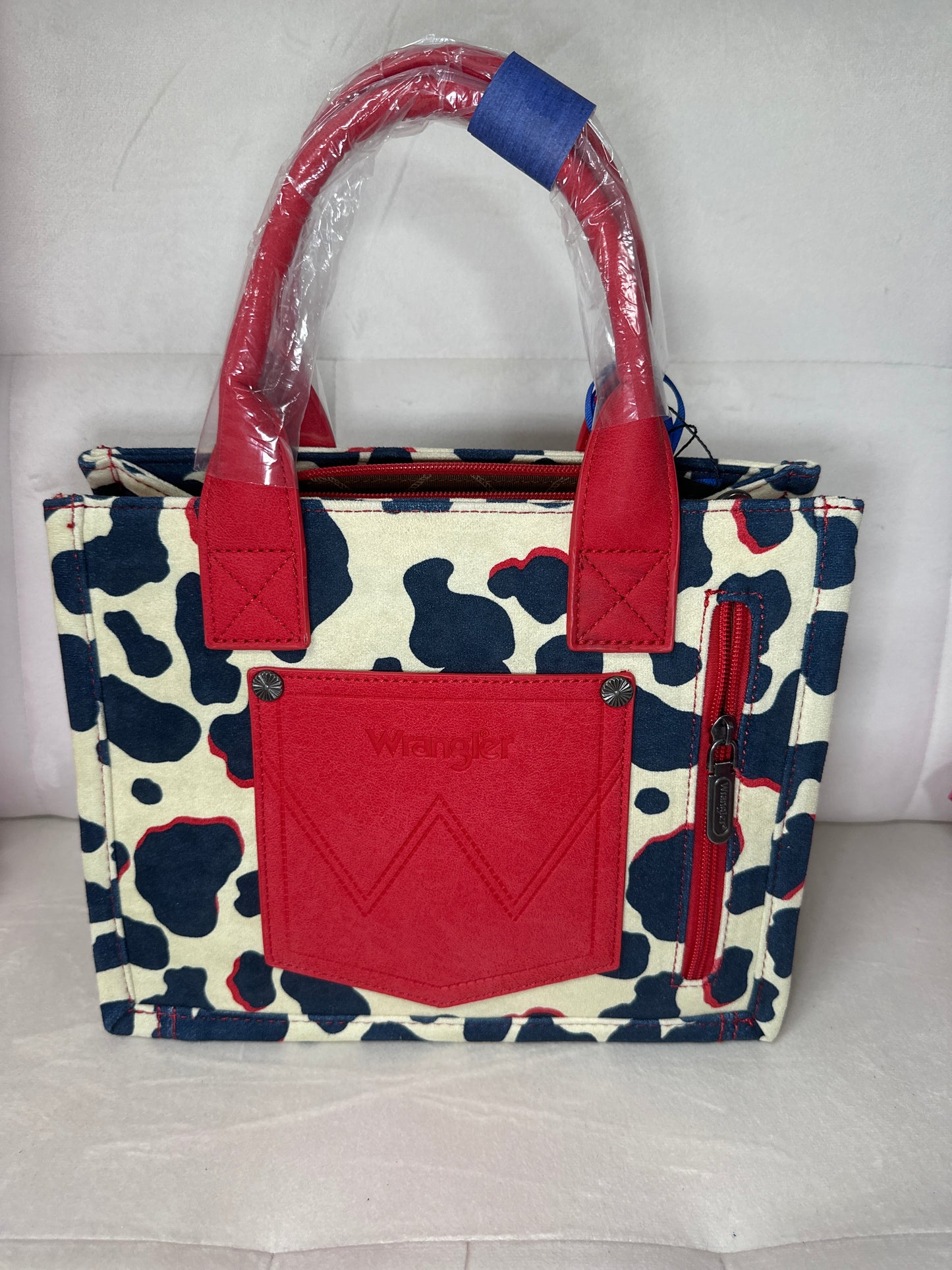 Wrangler cowprint tote w red concealed carry w/crossbody